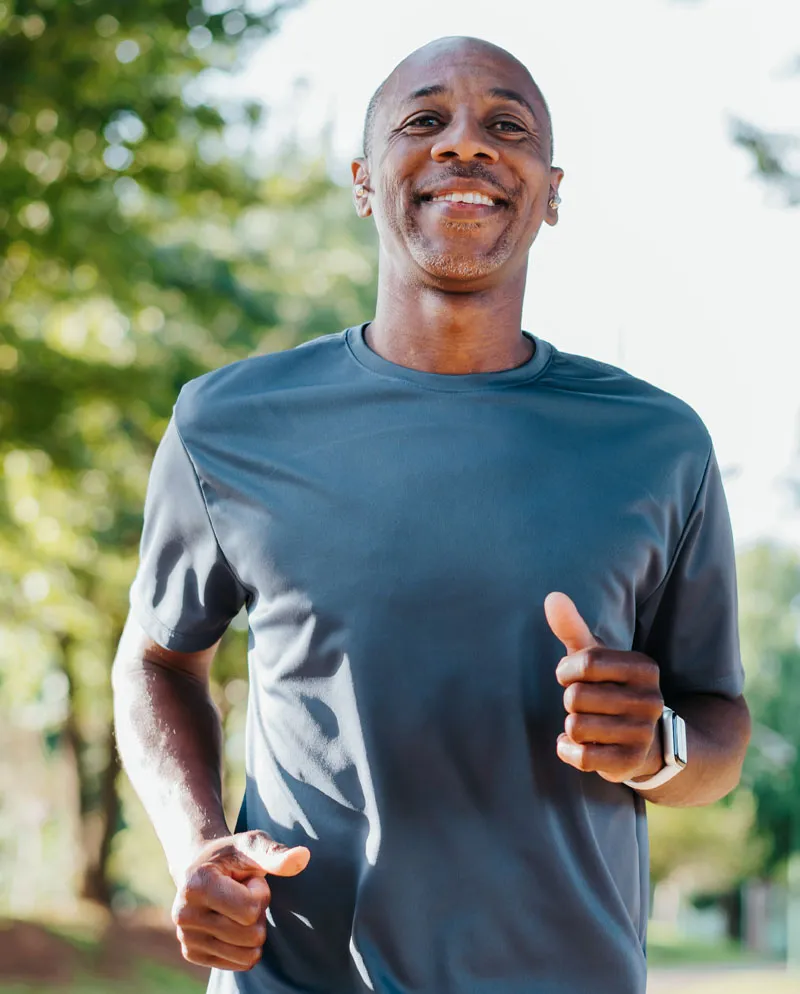 african american man running with blue shirt